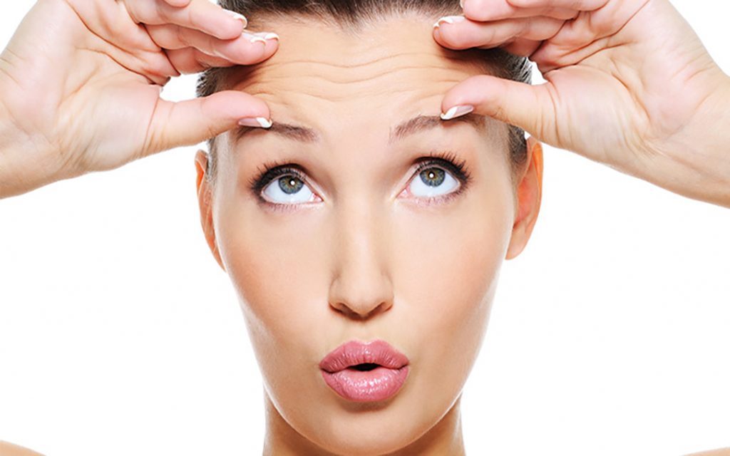 Lady holding eyebrows open